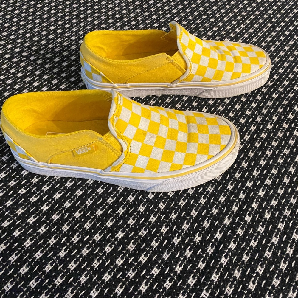 Woman’s yellow & white vans